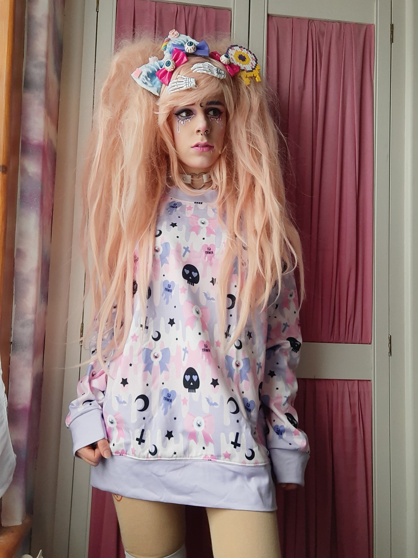 Youth model wearing a kawaii pastel goth cute and creepy shirt