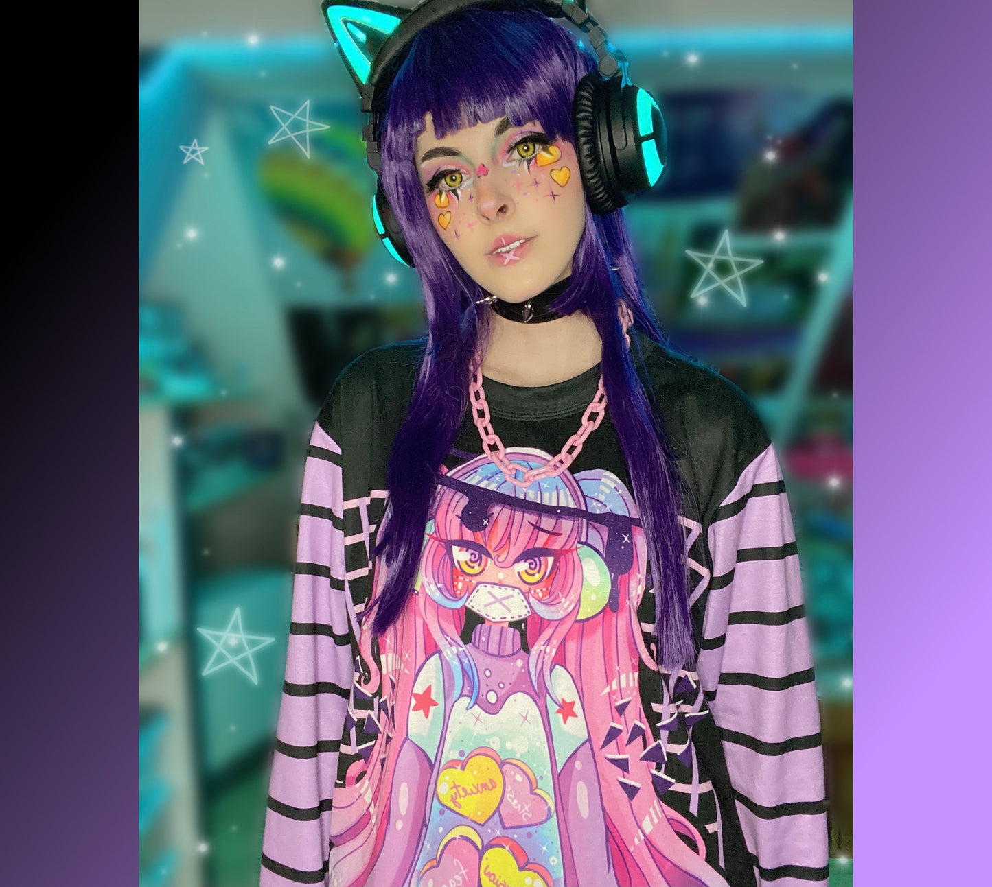 Young girl wearing a pastel goth sweatshirt with soft colors and creepy design.