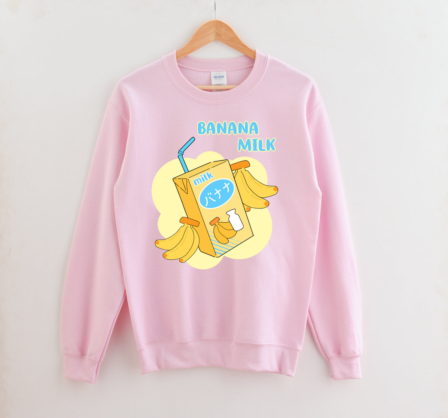 Pink pastel kawaii sweatshirt displayed on clean white background