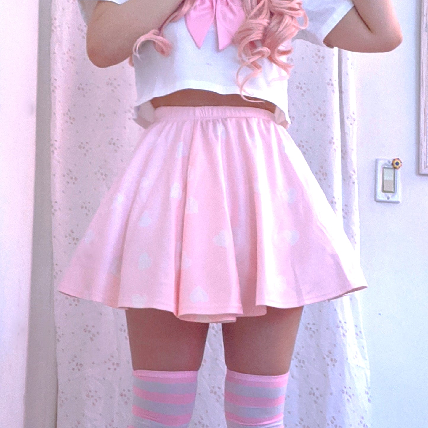 Youthful model wearing a cute kawaii skirt with pastel accessories