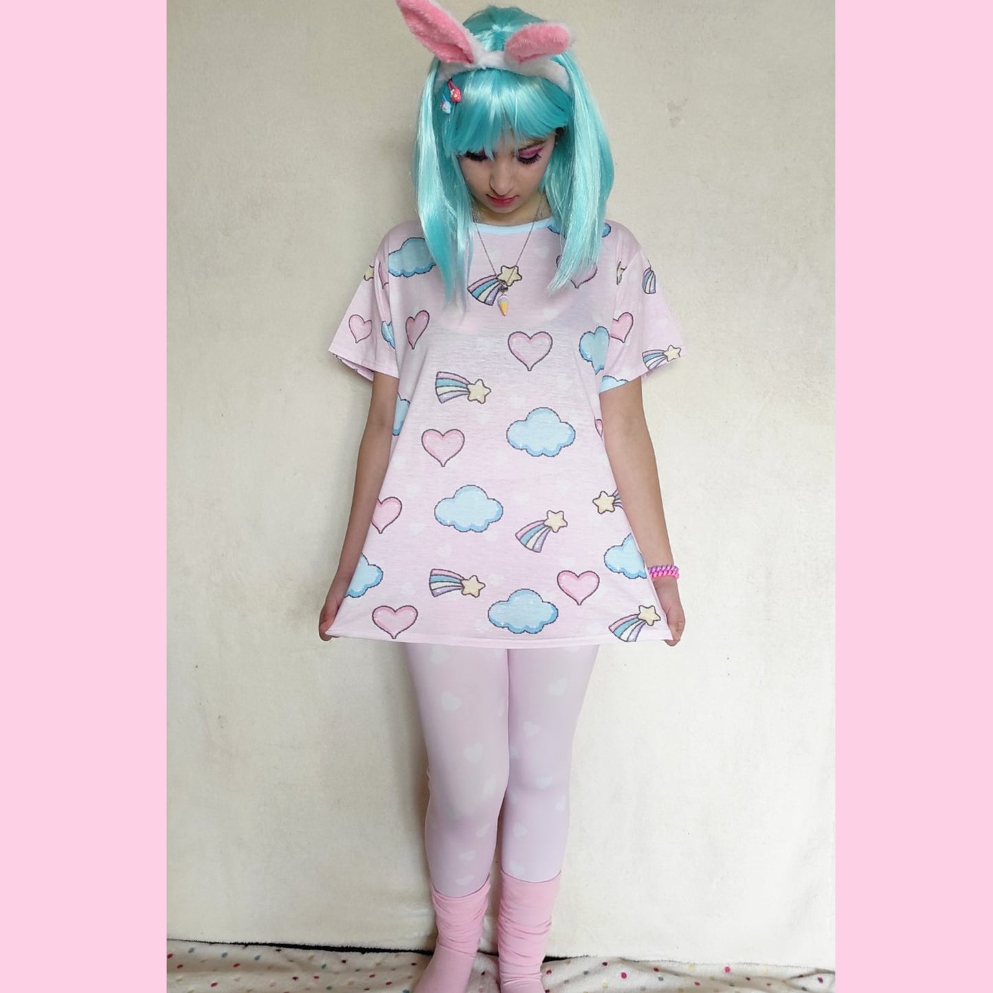 youthful model wearing pink heart yume kawaii leggings in pastel colours