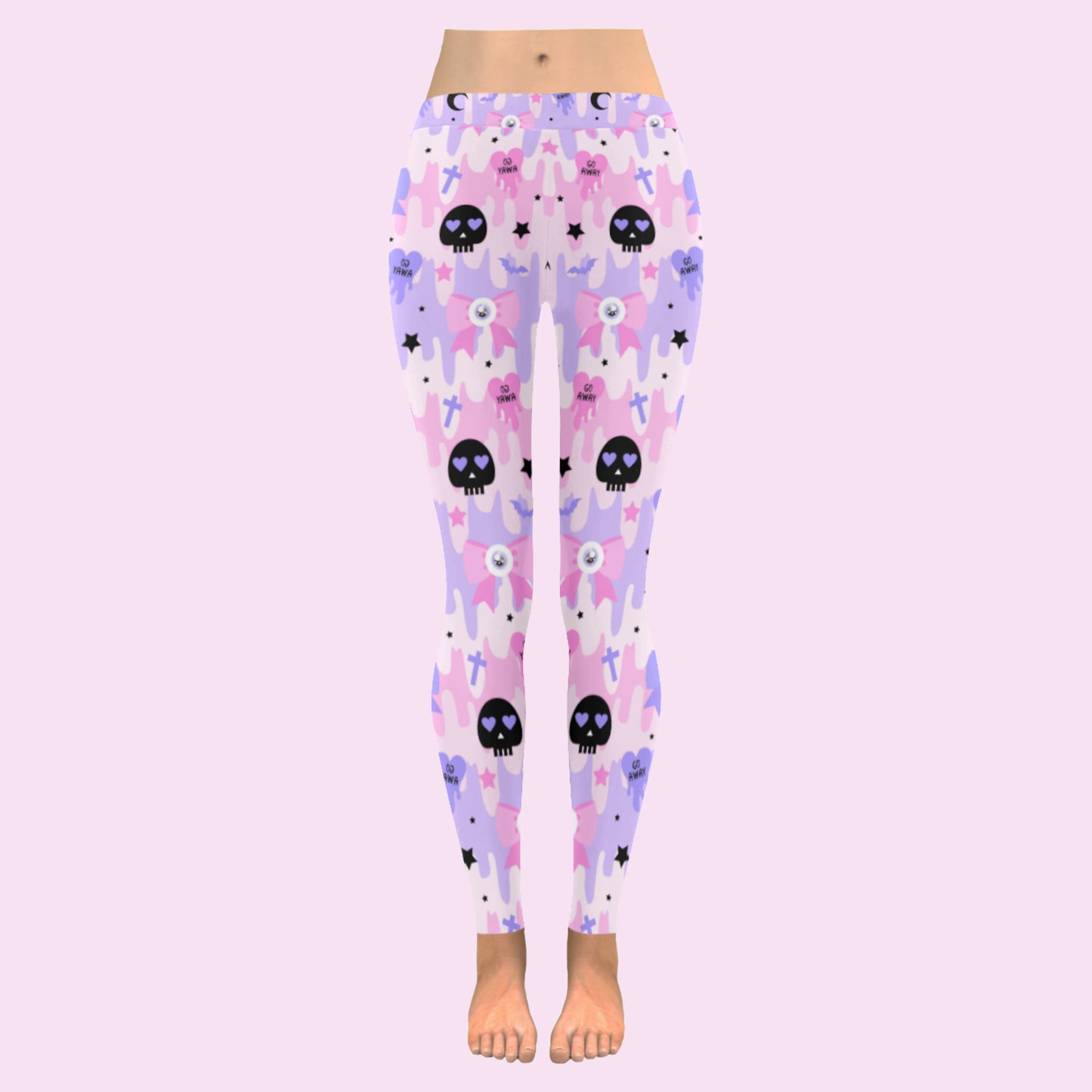 pink pastel goth skull leggings displayed on a pink background.
