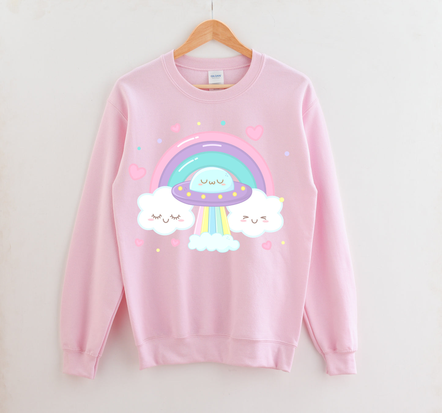 Pink kawaii sweatshirt displayed on clean white background.
