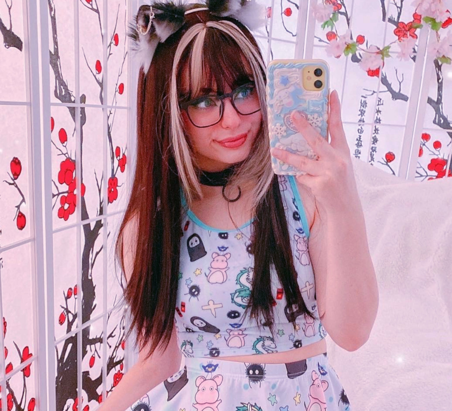 girl modeling a kawaii aesthetic t-shirt featuring playful, pastel artwork