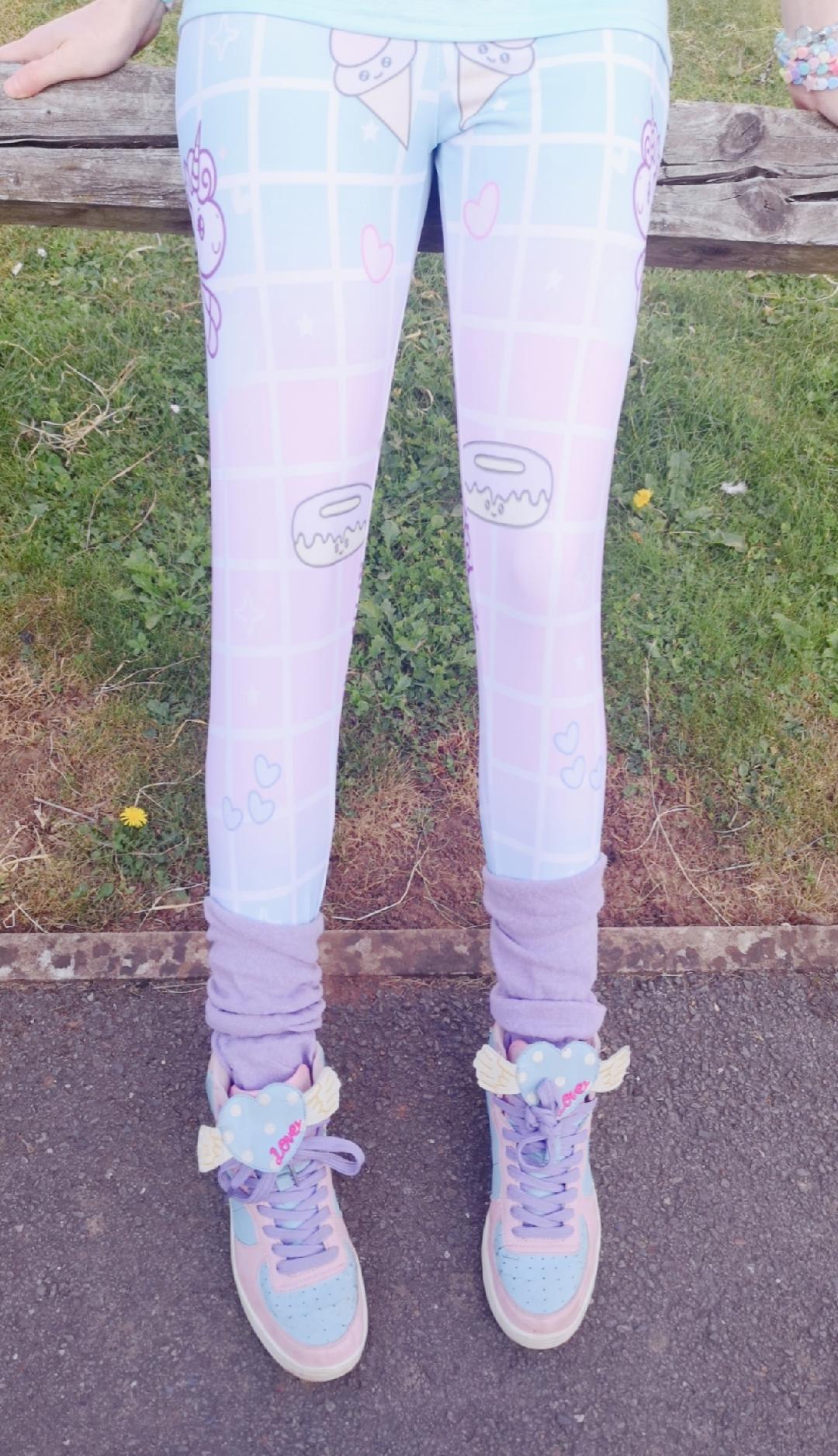 model wearing cute unicorn kawaii leggings in pastel colours