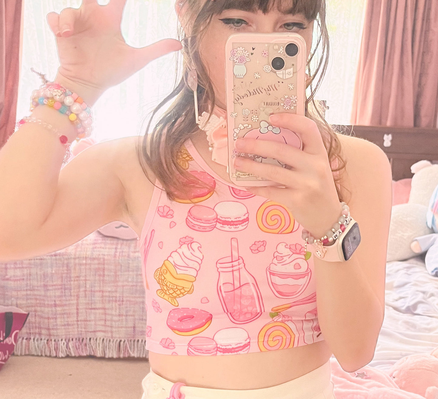 Teen girl in a kawaii graphic crop top with soft colors
