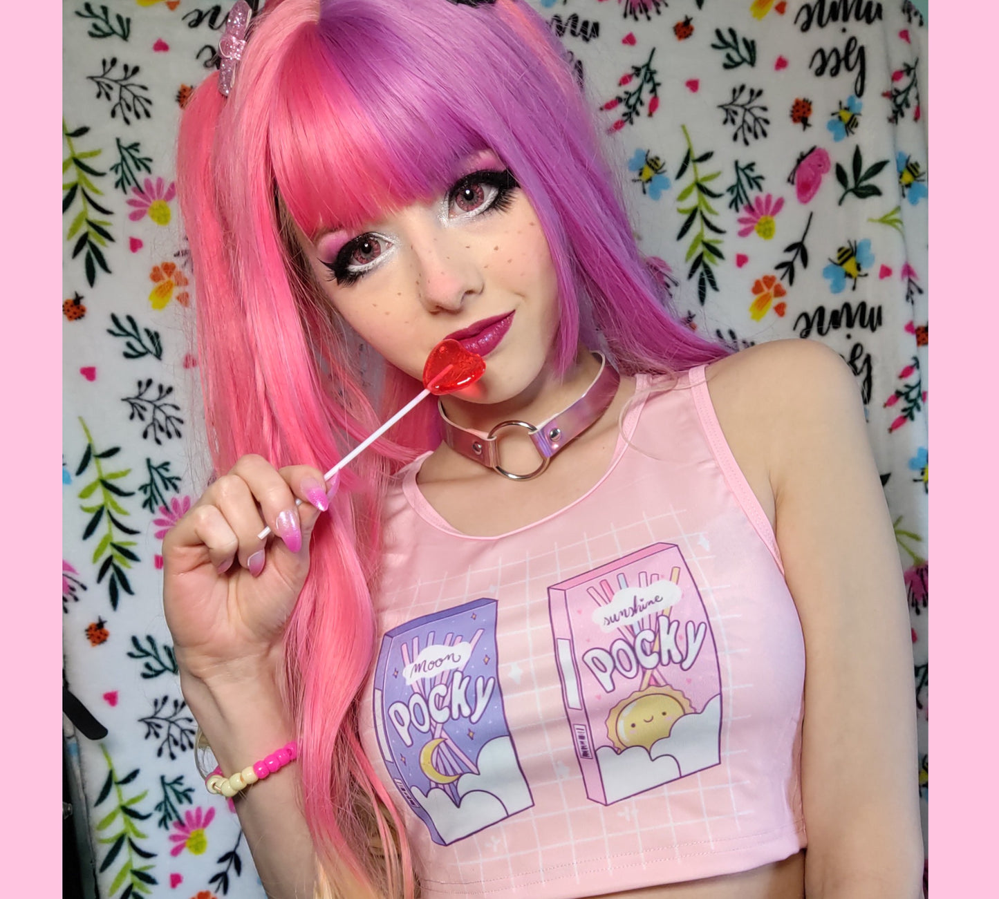 Cute girl modeling a kawaii aesthetic crop top featuring playful, pastel artwork