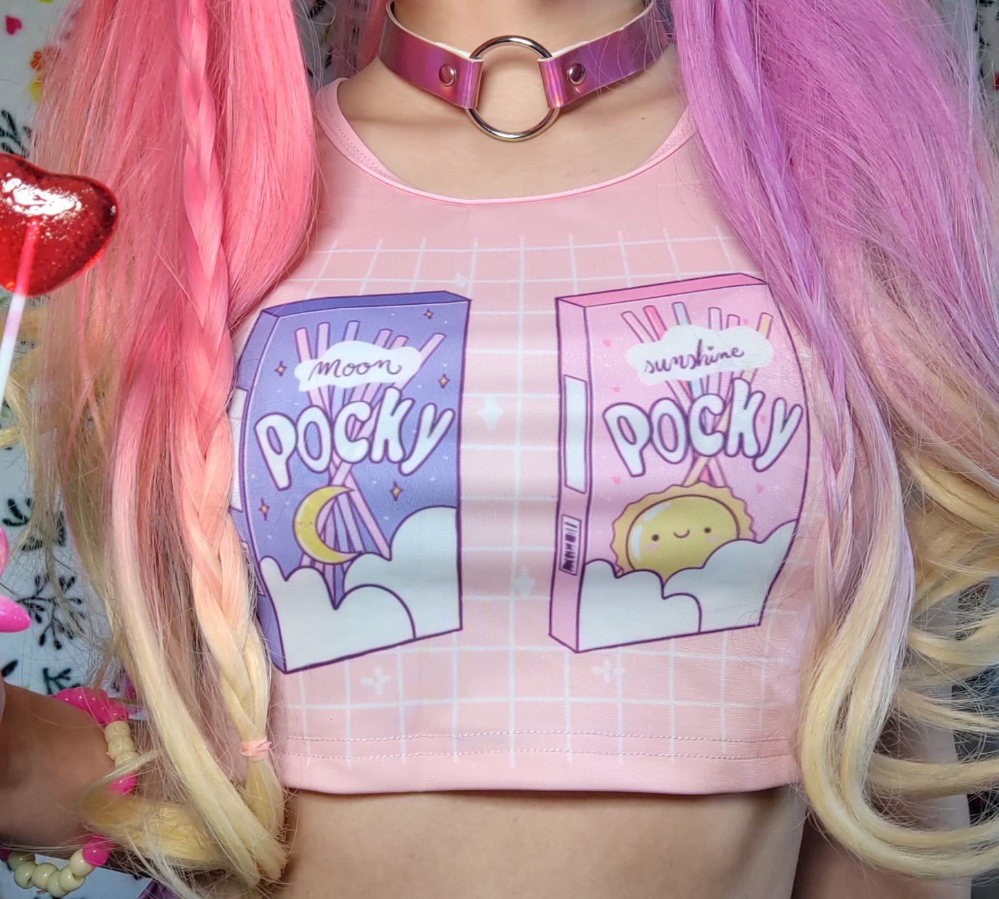 Cute girl modeling a kawaii aesthetic crop top featuring playful, pastel artwork