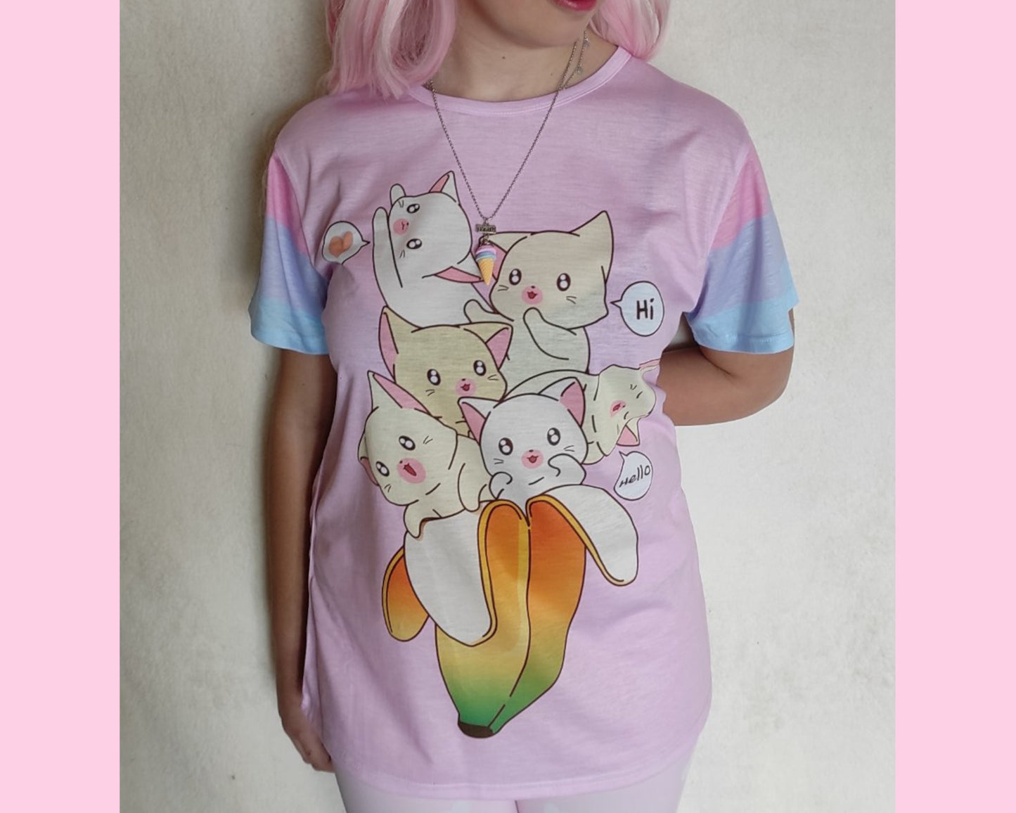 Young girl wearing a pastel kawaii t-shirt with a cute print of cats inside a banana