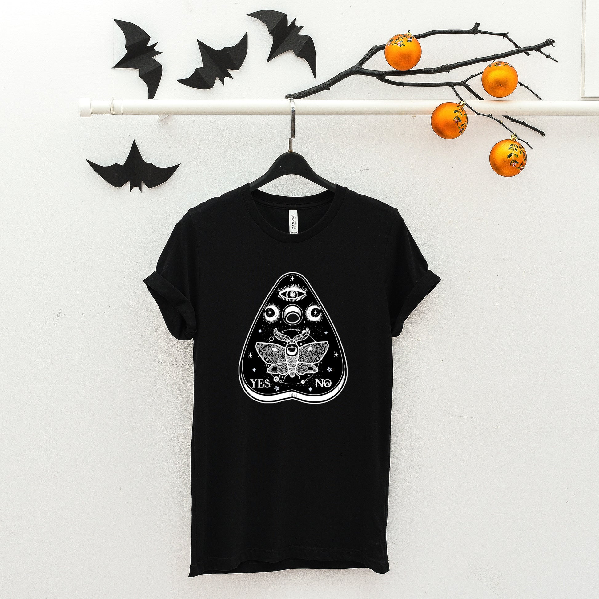 black witchcraft pastel goth t-shirt displayed on clean background.