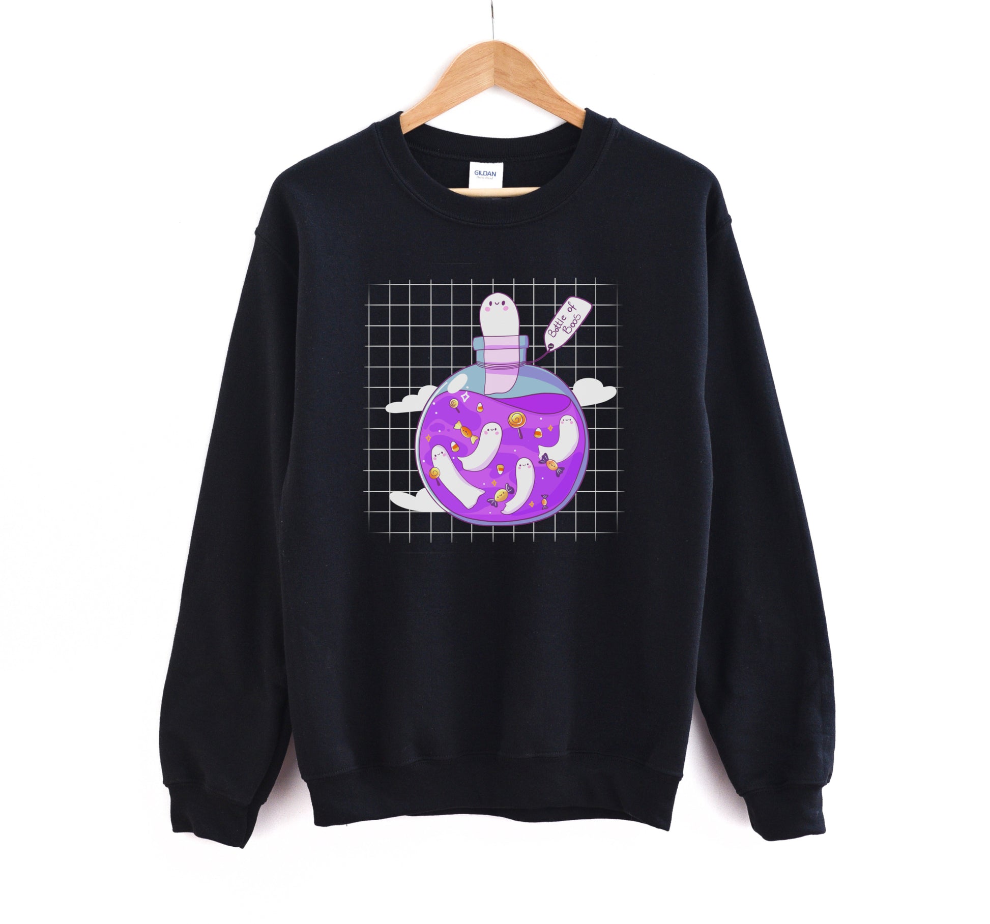 Kawaii Halloween sweatshirt with Halloween-themed graphics of a bottle of boos on a white background.