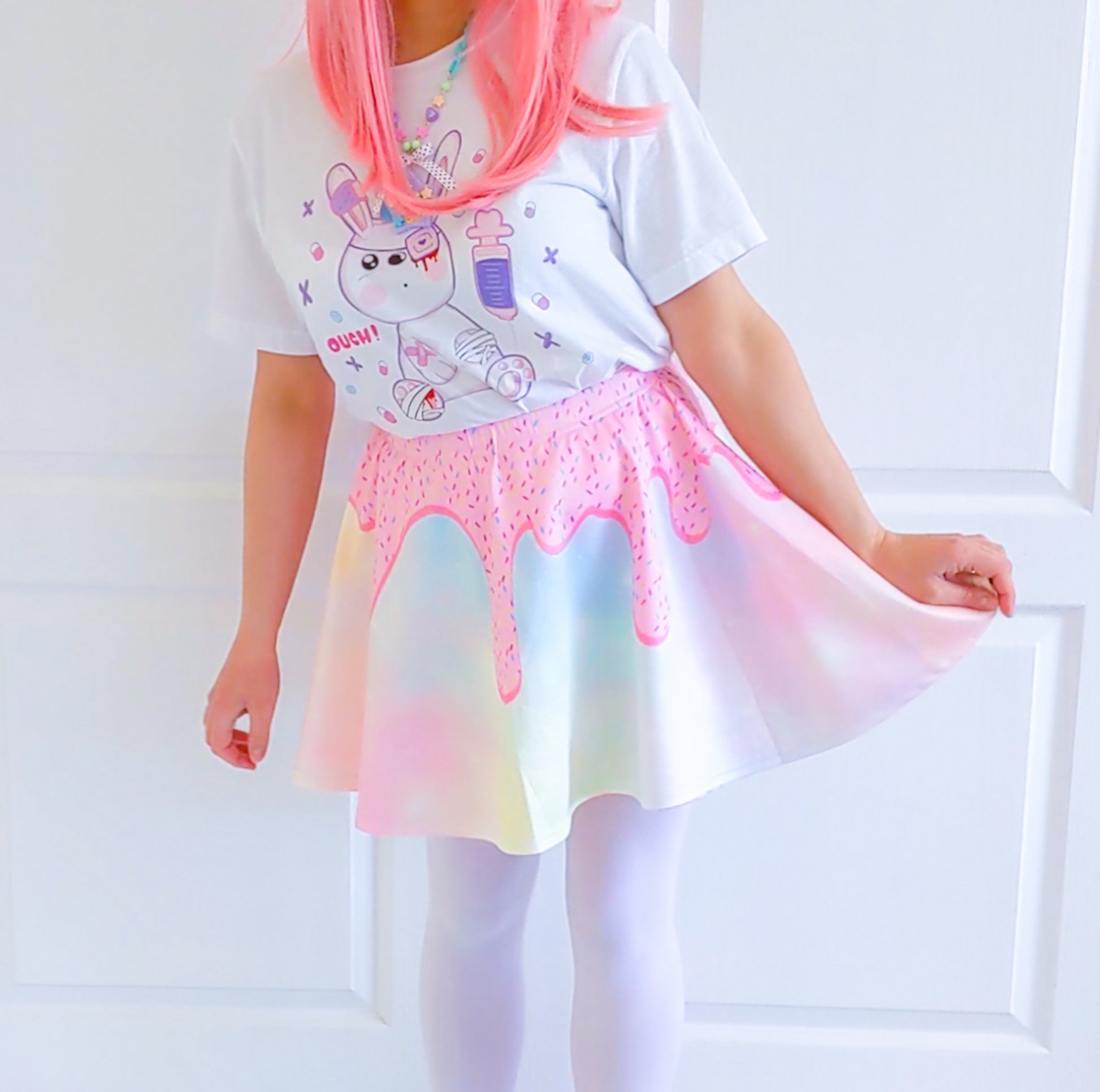 Happy girl dressed in a kawaii Donuts Sugar skater skirt styled 