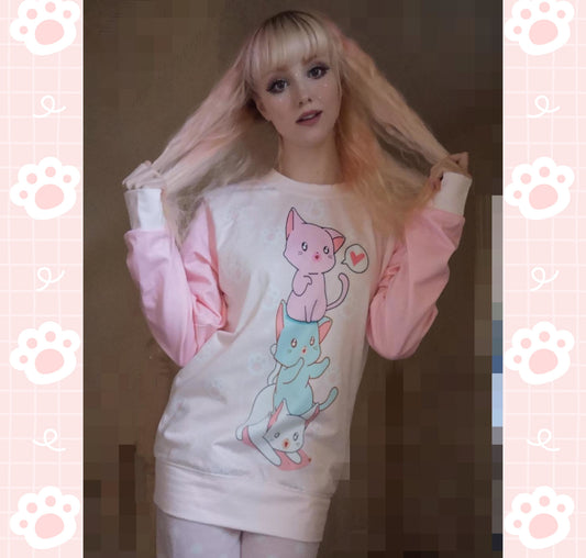 Young girl wearing a pastel kawaii sweatshirt with a cute print, smiling