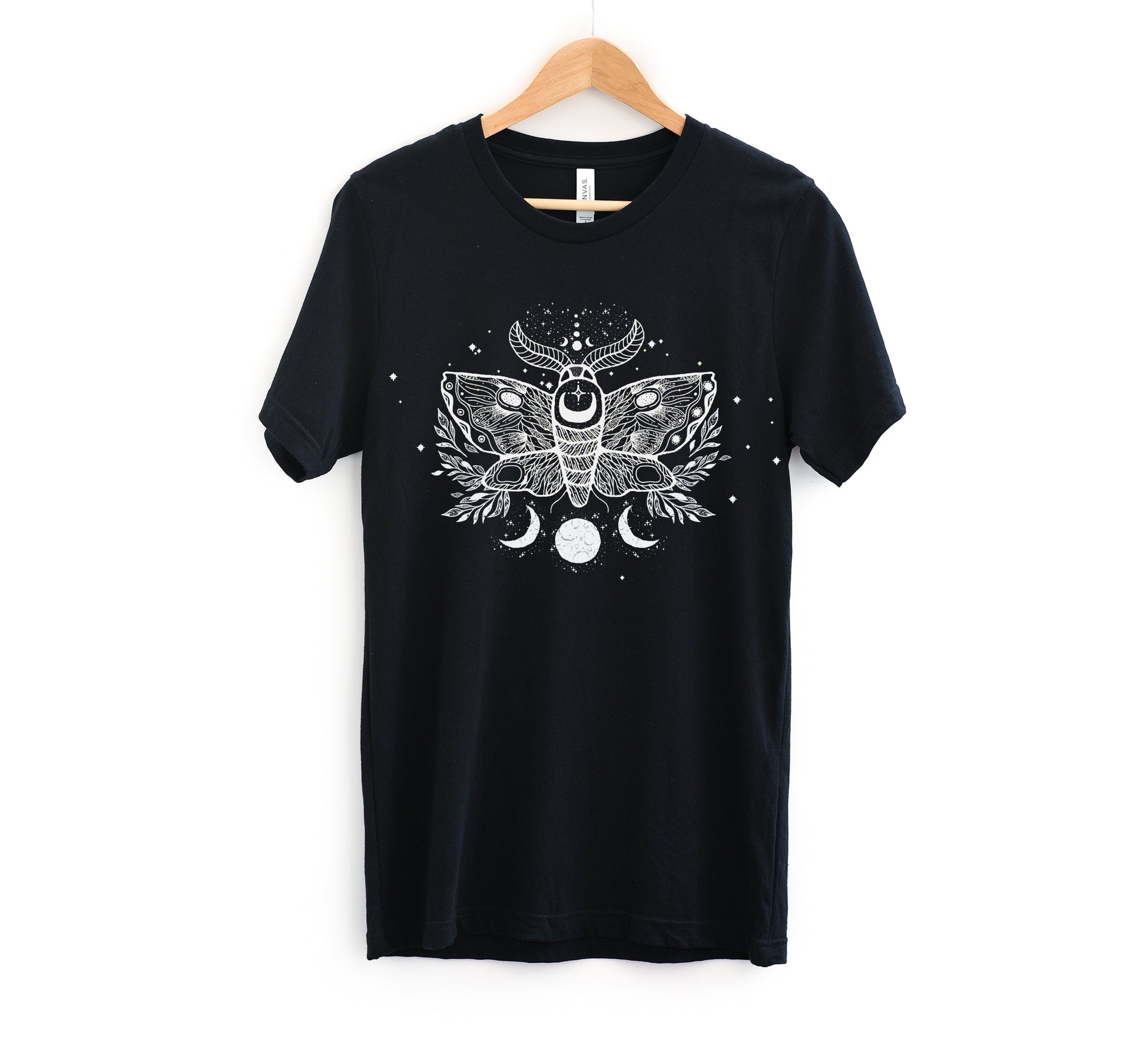 goth t-shirt with moth and moon print on white background.