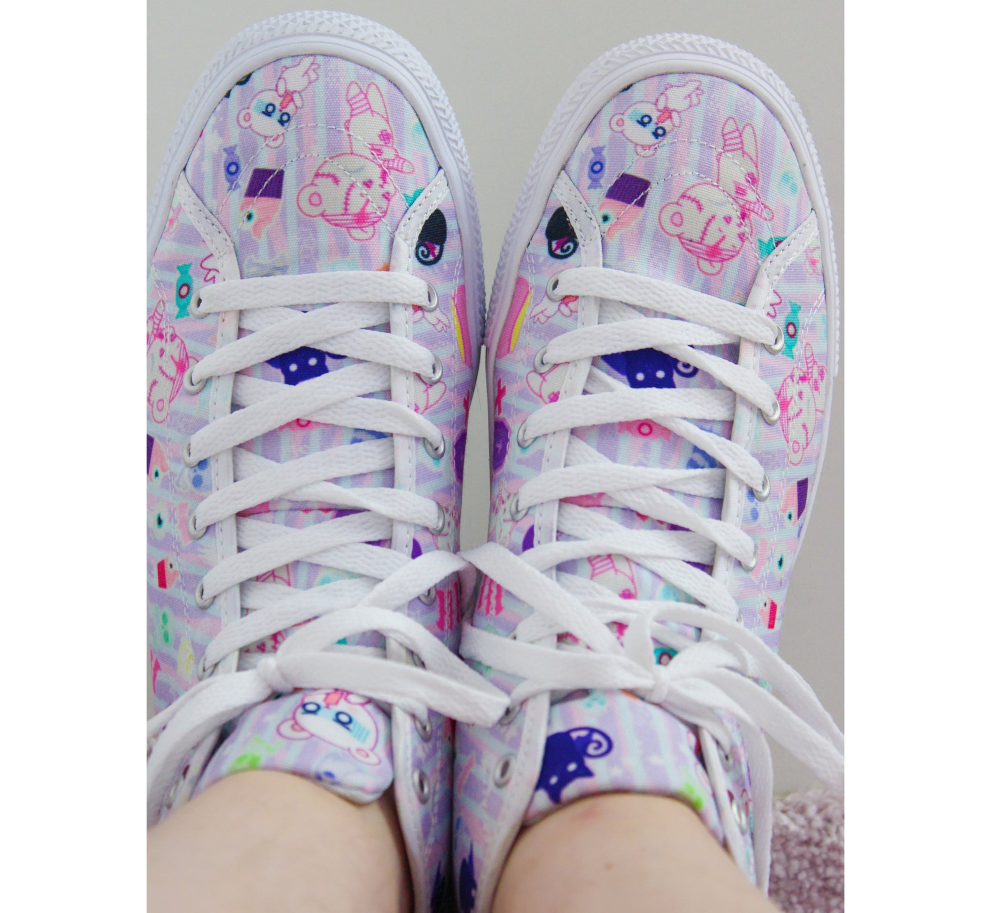 Young girl wearing stylish, cute shoes with a playful design