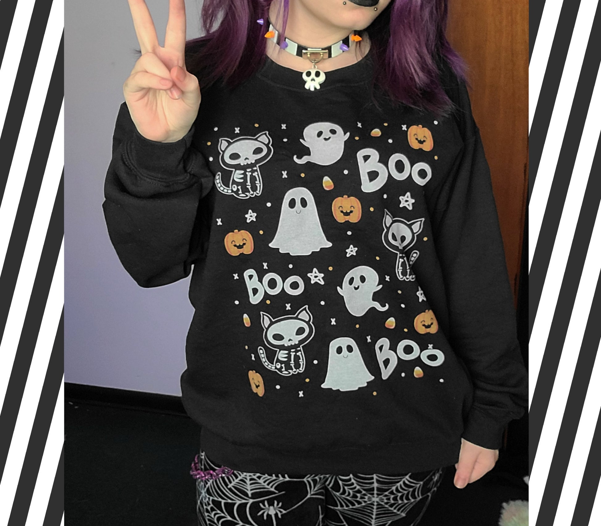 Girl modelling a kawaii Halloween cute sweatshirt with ghost designs 