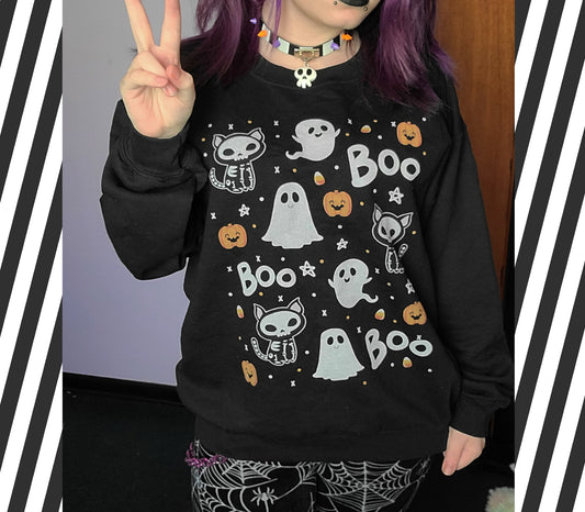 Girl modelling a kawaii Halloween cute sweatshirt with ghost designs 