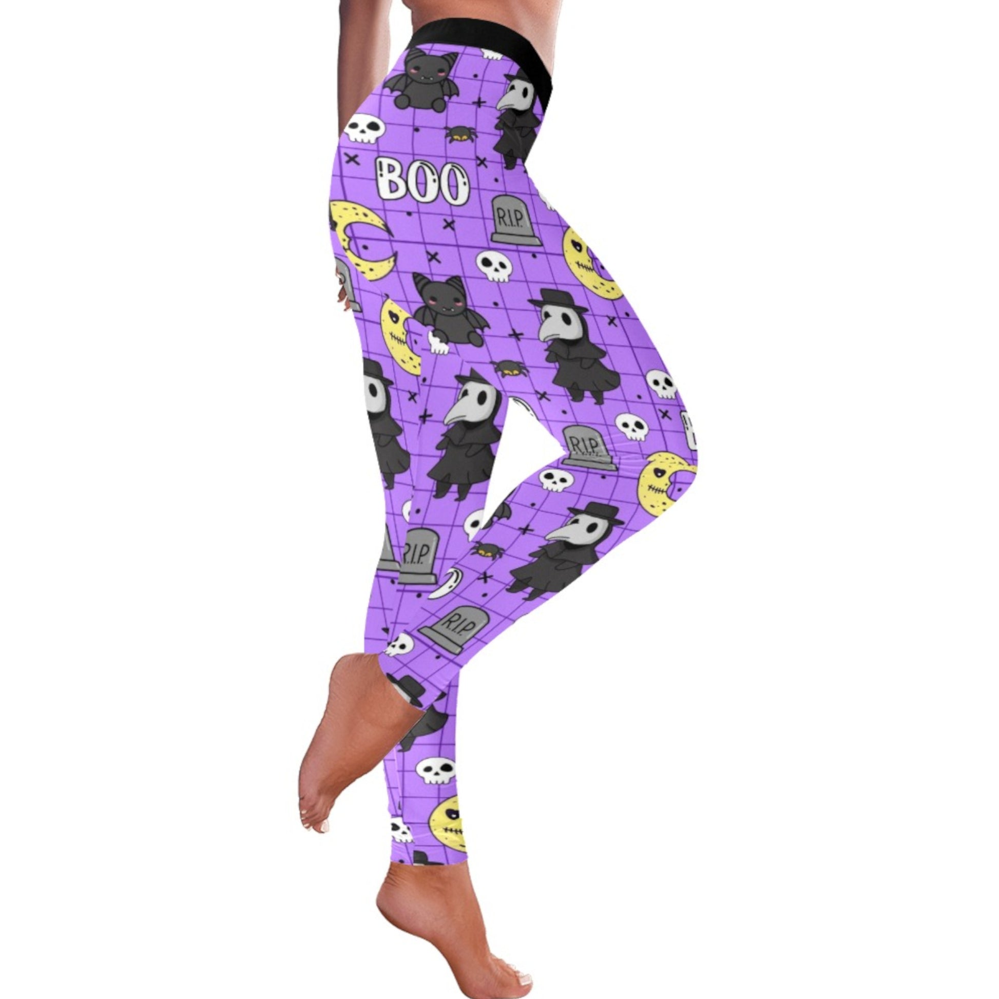 Purple leggings with Halloween-themed design worn by a person on a white background