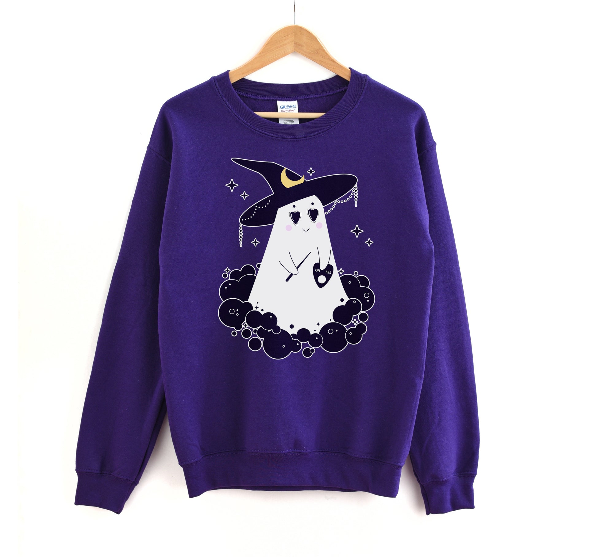 Purple sweatshirt with a ghost wearing a witch hat design on a white background