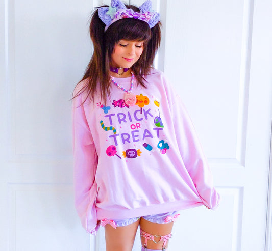 Girl modelling a Kawaii Cute Halloween sweatshirt with spooky candies design
