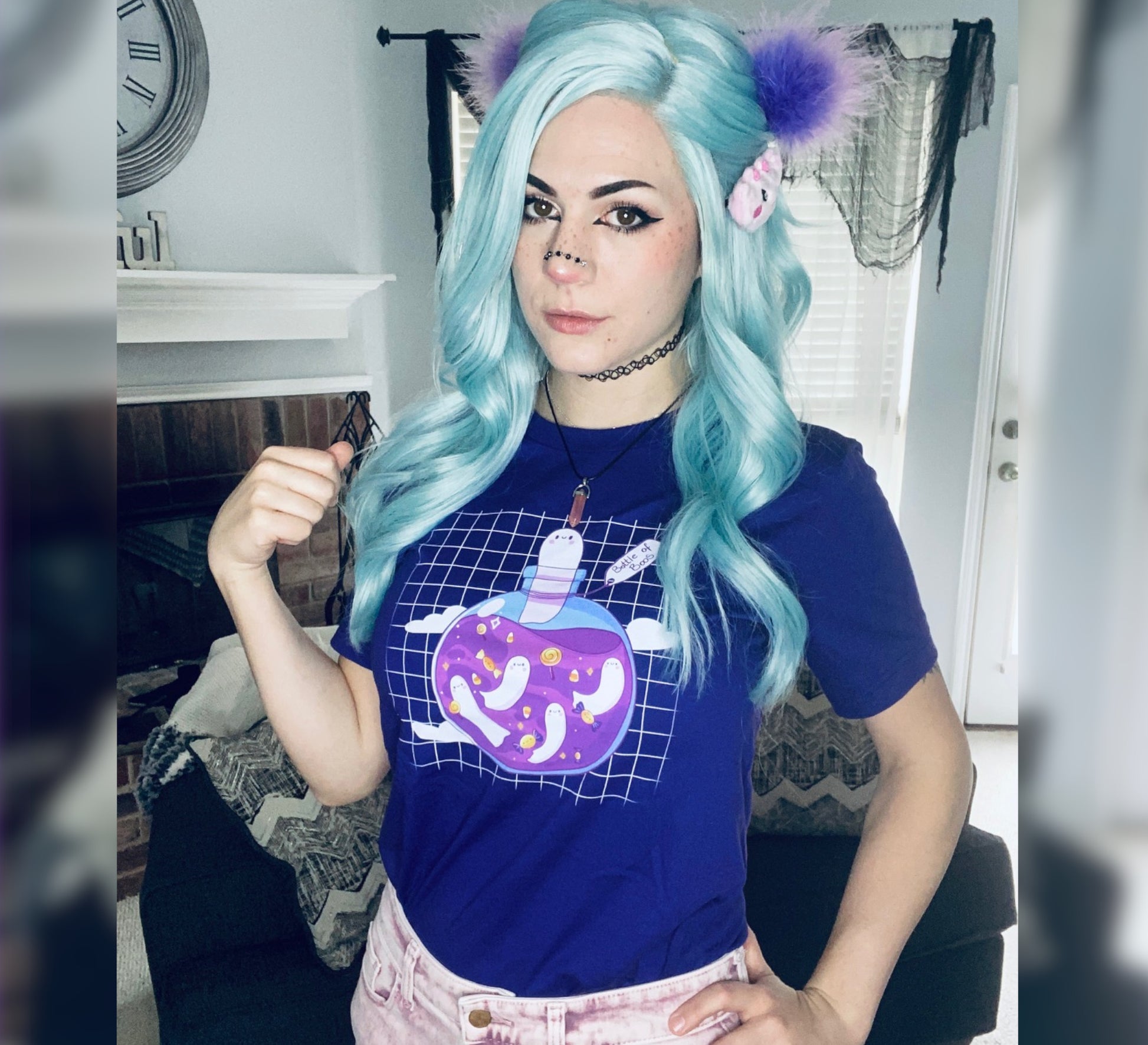 Girl with blue hair wearing a purple cute Halloween t-shirt 