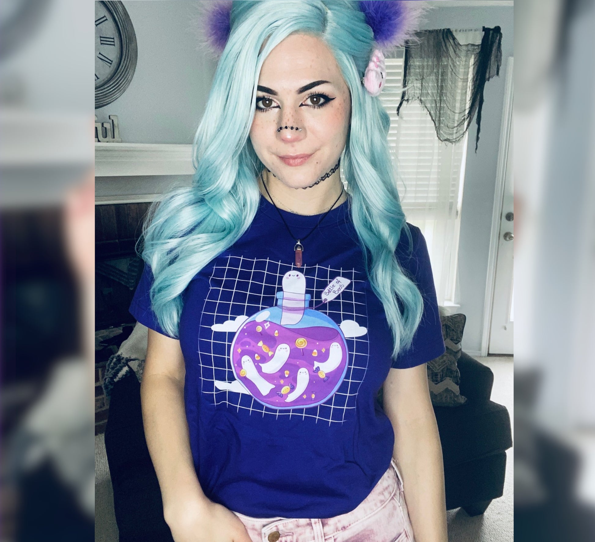 Girl with blue hair wearing a purple cute Halloween t-shirt 