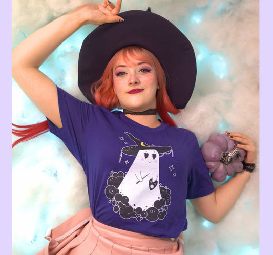 Young girl wearing a pastel goth Halloween t-shirt with cute ghost desing.