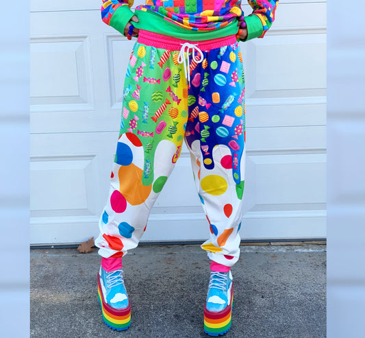 Young boy wearing Kidcore Rainbowcore Harajuku jogger pants with candy print 