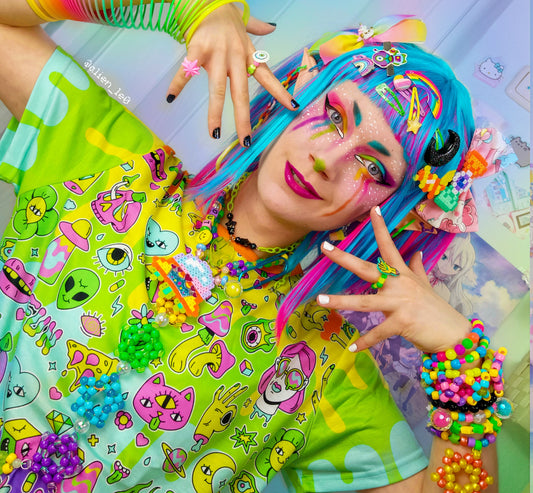 Young boy wearing a Harajuku Kidcore t-shirt with a rainbow print