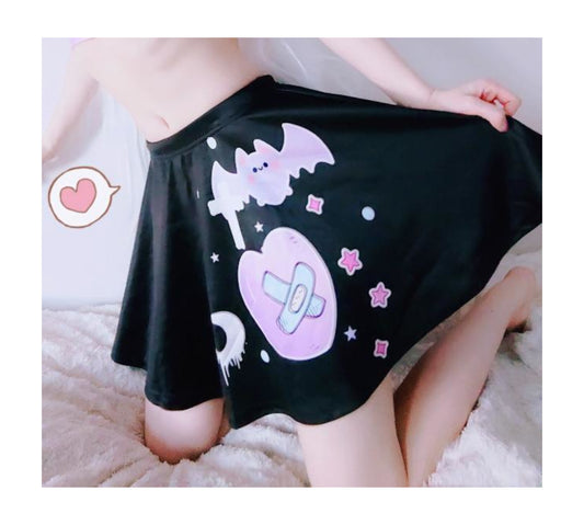 Girl modeling a  Menhera  pastel goth skirt in pink and black design