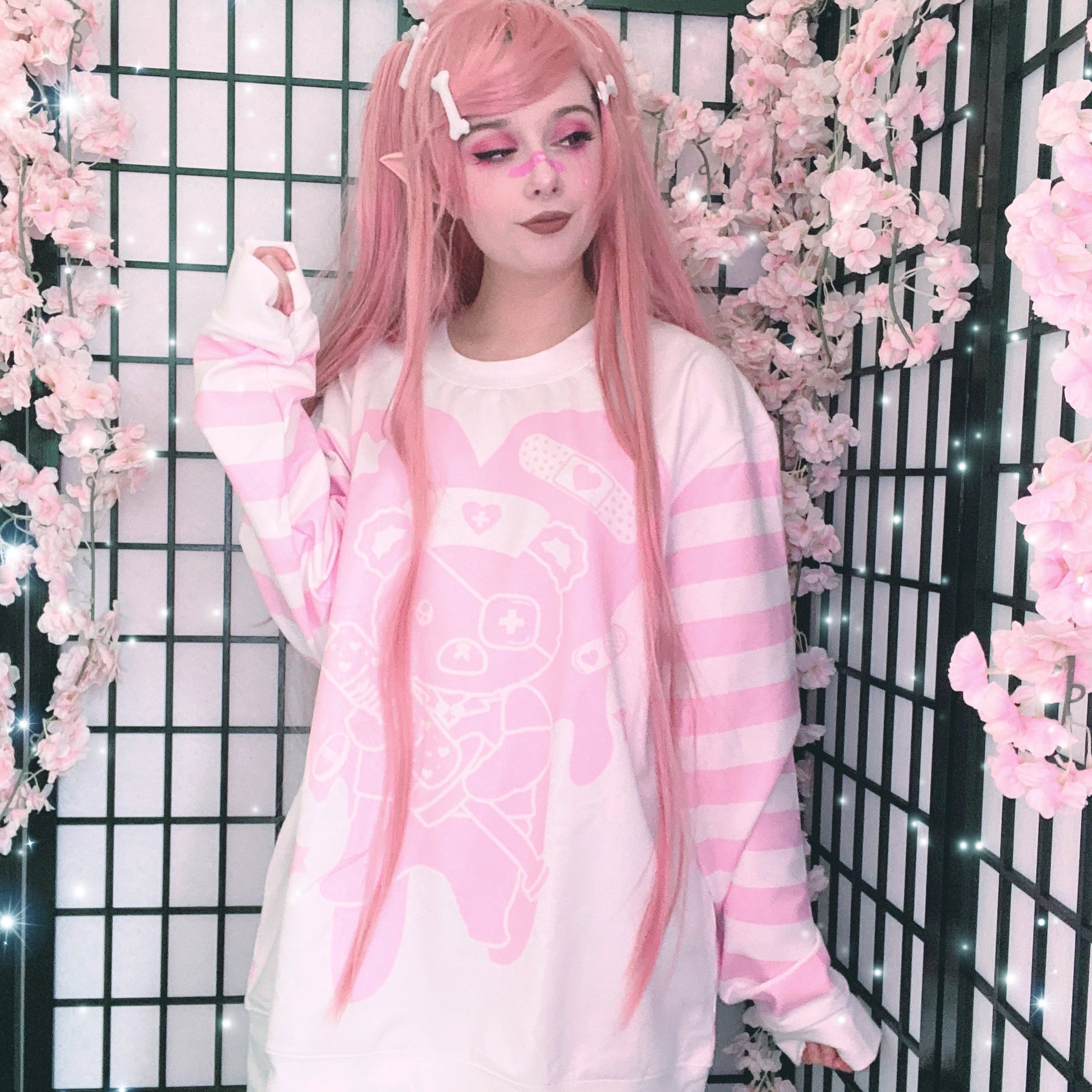 Young girl wearing a menhera  kawaii sweatshirt with a cute and creepy print