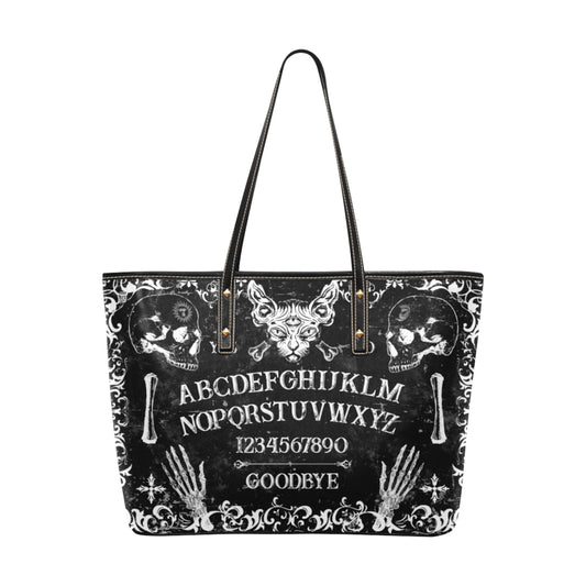 Black Ouija Board tote bag with white text and designs on a white background
