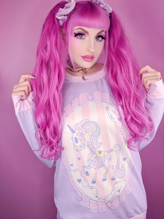 Teen girl dressed in pastel goth fashion with a cute graphic t-shirt
