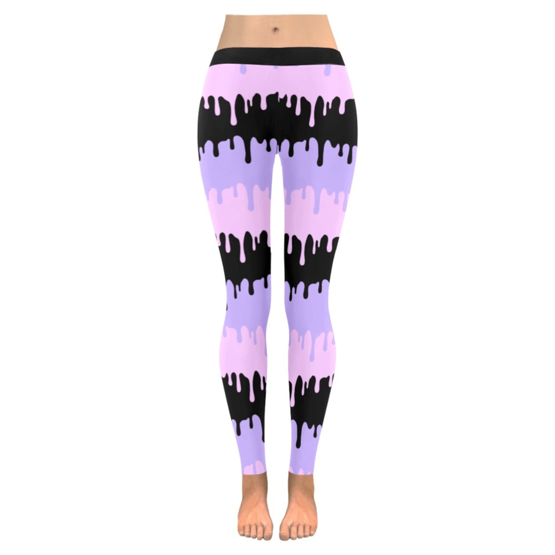 Pink and black pastel goth leggings displayed on clean white background