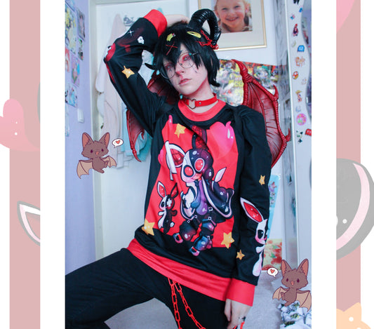 Young boy wearing a pastel goth sweatshirt with creepy demon bunny design