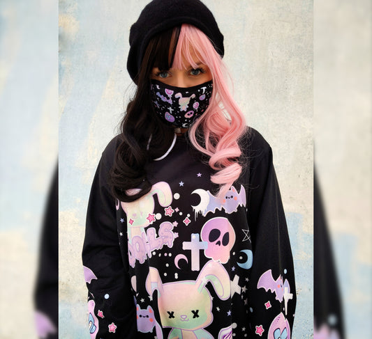 young model wearing a Pastel goth creepy cute bunny skull Halloween hoodie dress