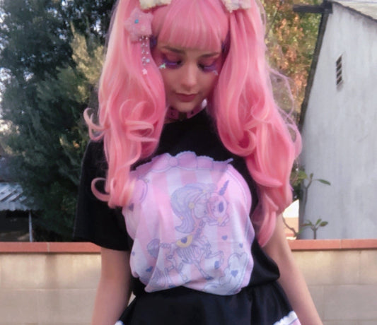 Youth model wearing a kawaii pastel goth unicorn skeleton t-shirt 