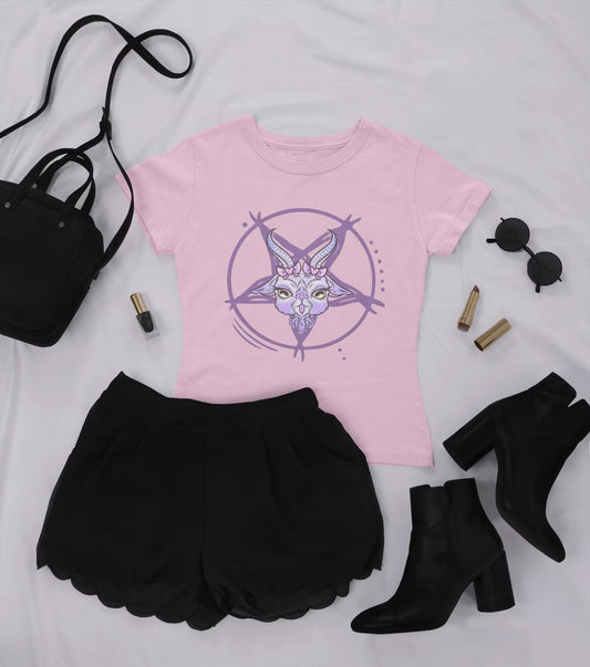 Pastel goth sweatshirt with goat laid flat on a white background with black skirt, shoes and bag