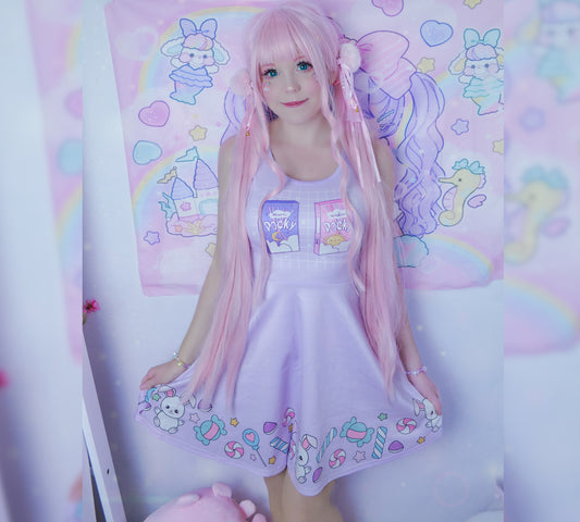 young model wearing a cute Pocky Kawaii Skater dress with candies