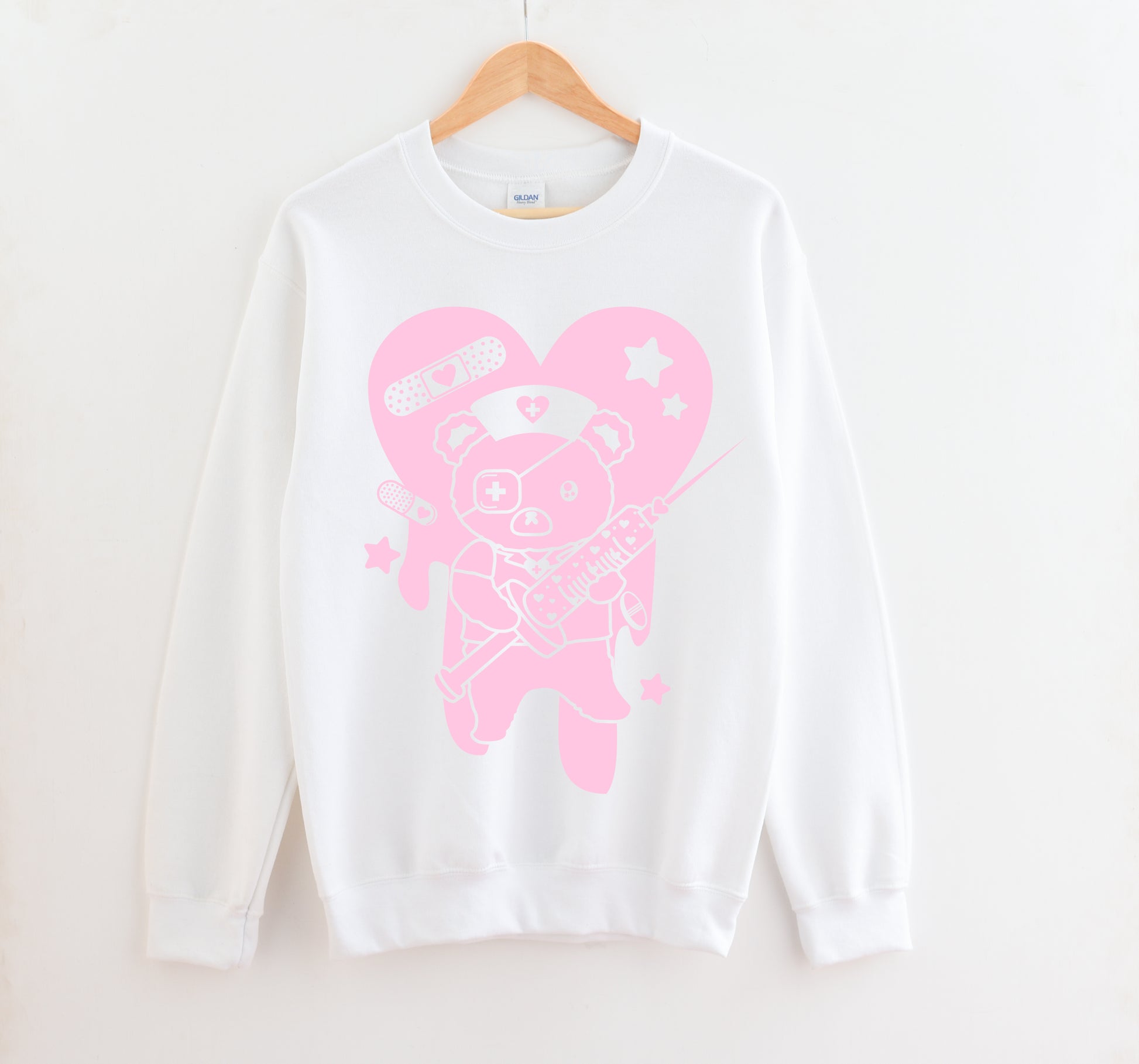 White Menhera Kei Bear Band Aid kawaii aesthetic sweatshirt displayed on clean background.