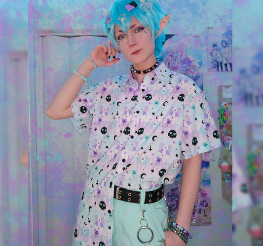 Youth model wearing a kawaii pastel goth shirt with skulls