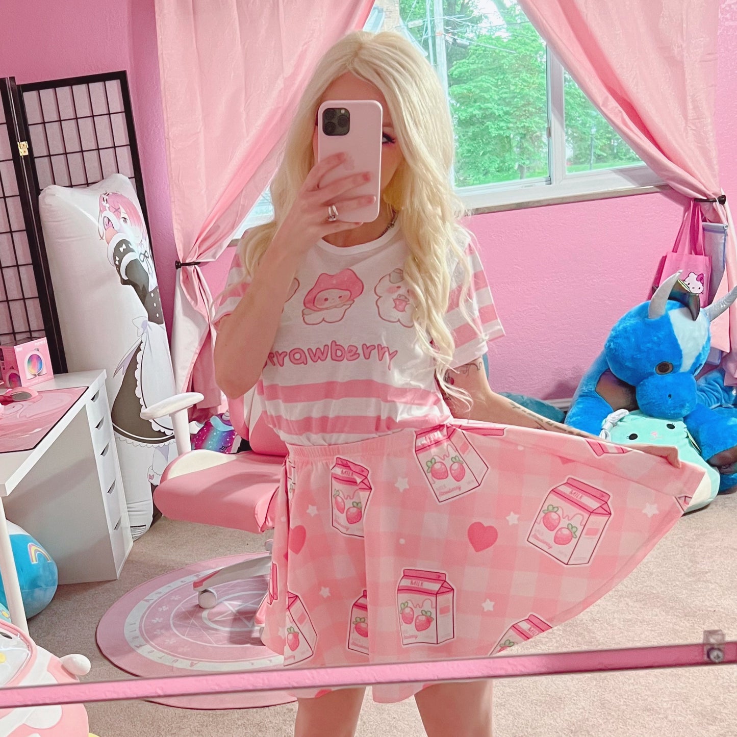 Youthful model wearing a cute Yume kawaii Fairy Kei Pastel pink strawberry skirt