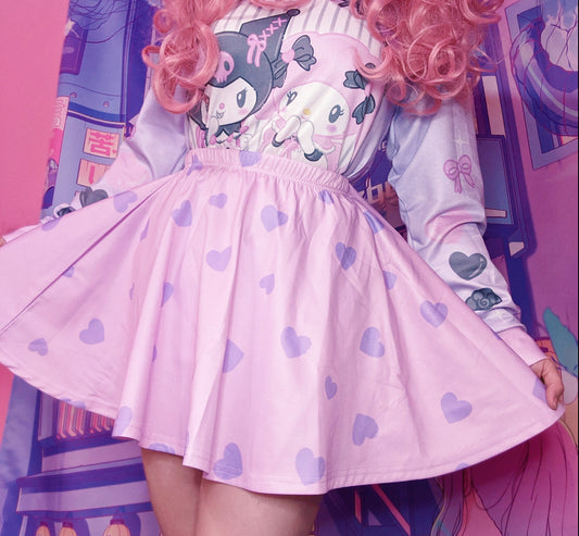 Young girl wearing a pastel kawaii skirt with purple hearts