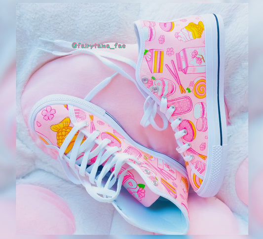 Close-up of cute pastel-colored shoes with decorative elements, displayed on a smooth  surface