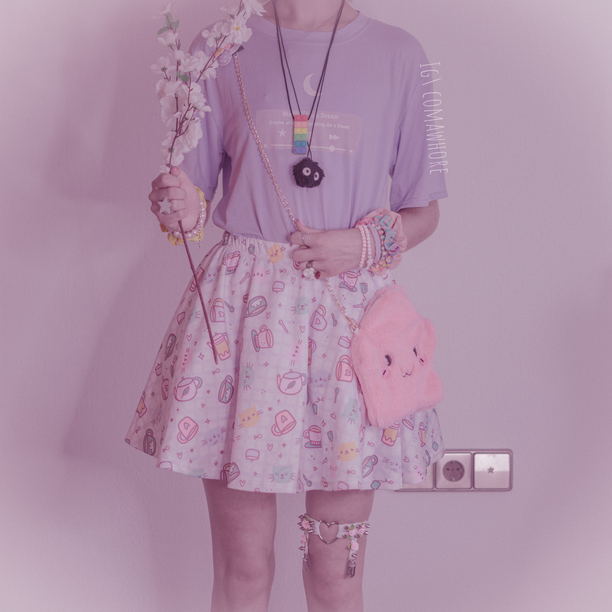  girl modeling a kawaii aesthetic t-shirt featuring playful, pastel artwork