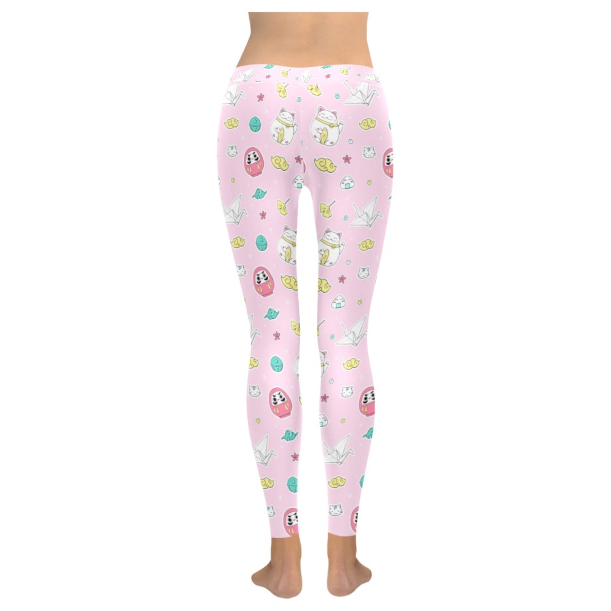 Pink pastel kawaii leggings displayed on clean white background.