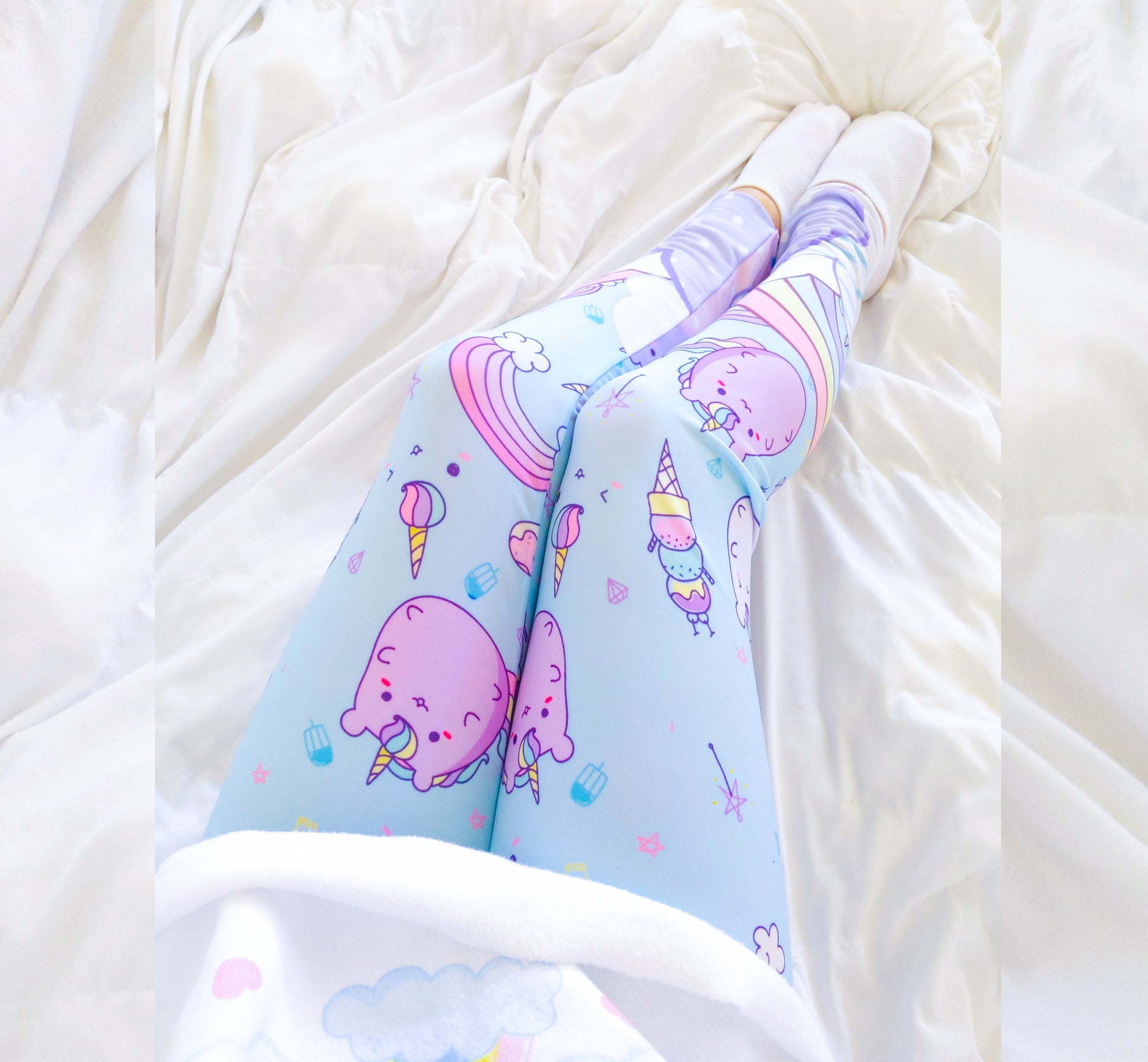 Youthful model wearing  cute yume kawaii rainbow cloud cat leggings