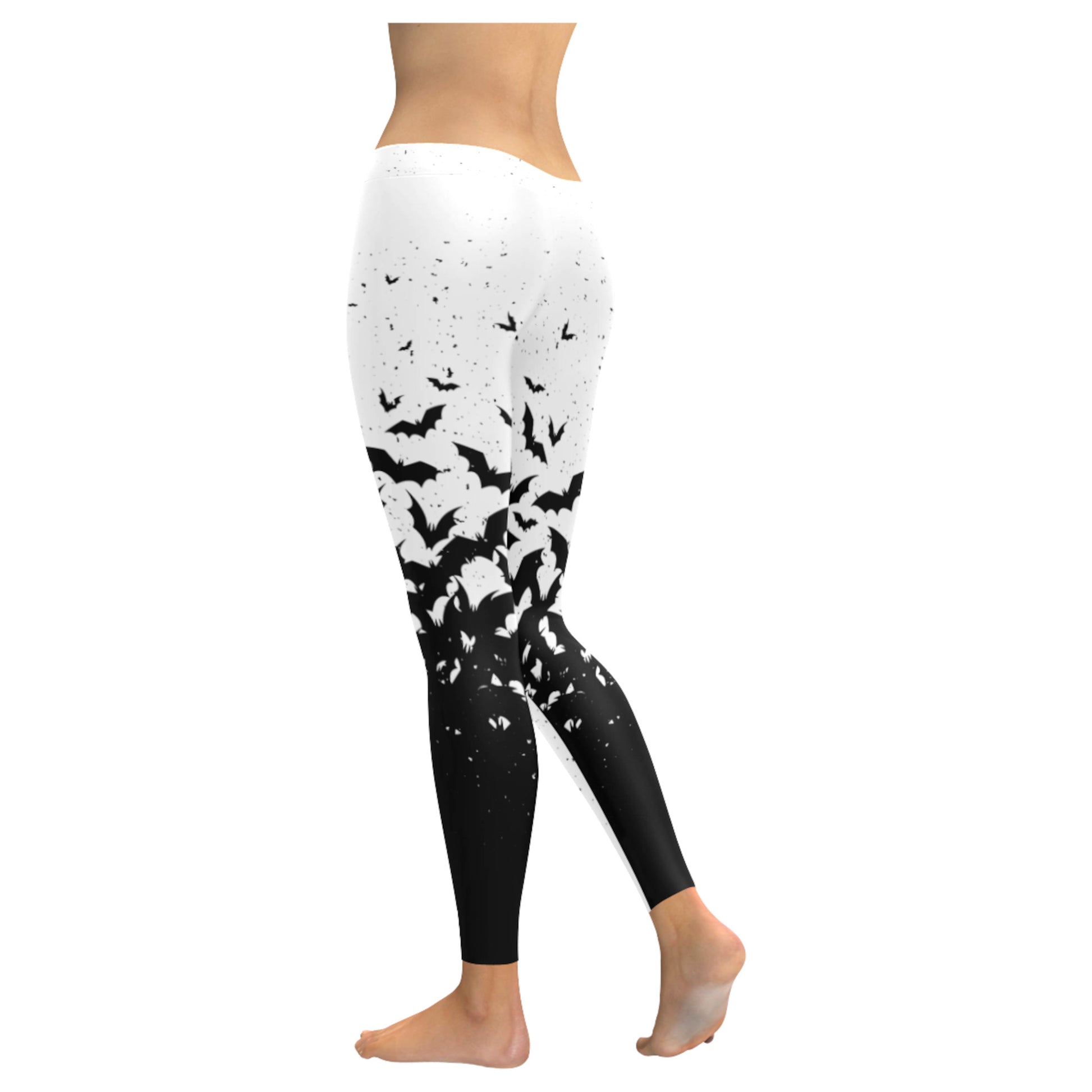 White and black pastel goth leggings displayed on clean white background.