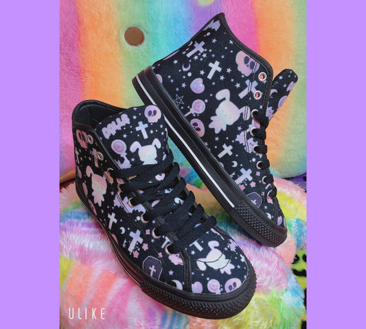 Pair of cute, stylish shoes neatly arranged on a colourful background 