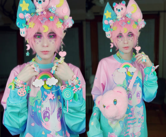 Kawaii boy with pastel makeup wearing a kawaii sweatshirt and styled in soft pastel fashion.